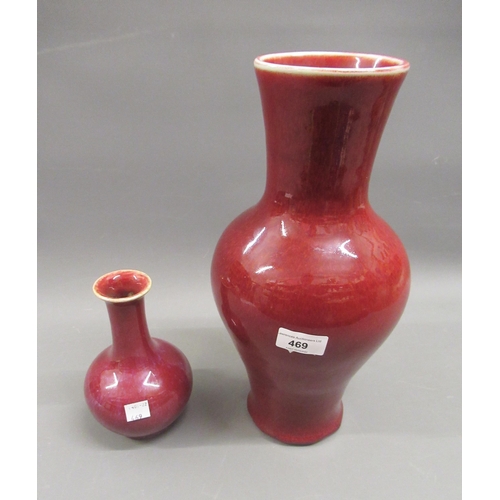 469 - Chinese Sang du Boeuf baluster form vase, 14ins high together with a similar smaller vase, 7ins high... 