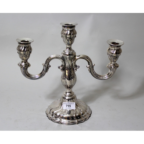 715 - Continental silver (835 mark) three light candelabra, 11ins high, 15oz