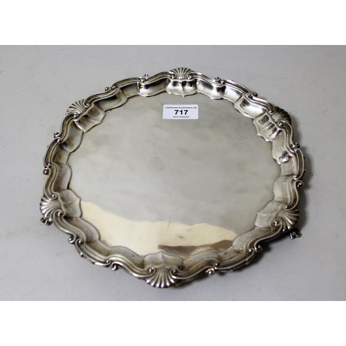 717 - Small late Victorian silver salver in 18th Century style, the shaped moulded shell pattern rim on th... 