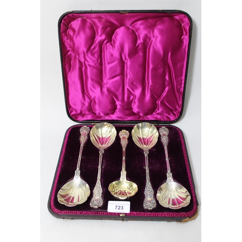 723 - Set of four late Victorian silver fruit spoons with scallop shell bowls and cast handles, London, 18... 