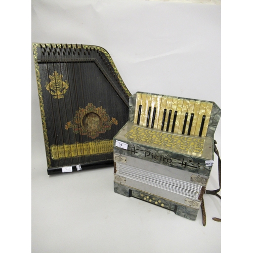 73 - Child's Pictro German piano accordion, together with a wooden zither