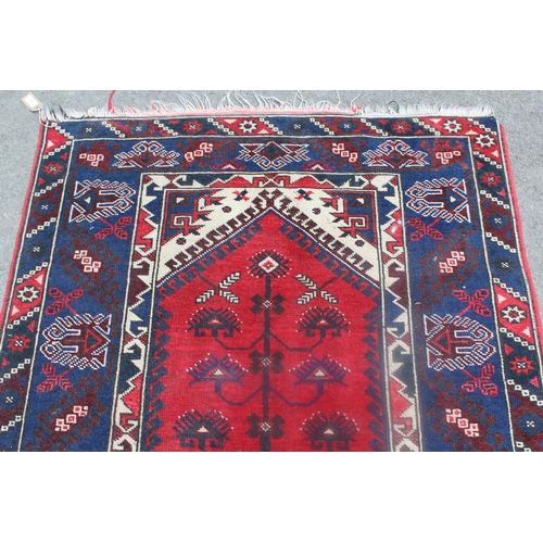 8 - Turkish rug on red ground with medallion design and borders, 57ins x 33ins