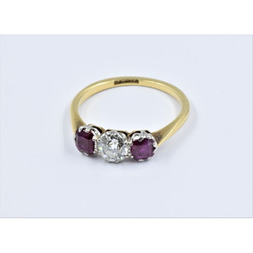 854 - 18ct yellow Gold and platinum ring, the central diamond of approximately 0.25ct flanked by two small... 