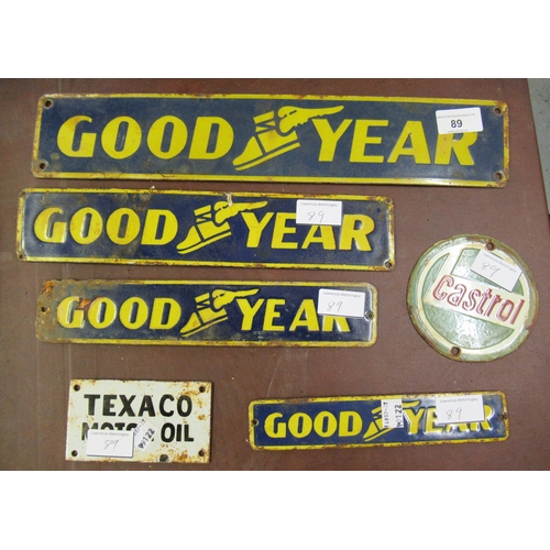 89 - Four small enamel signs for Goodyear tyres, the largest 3ins x 16ins together with a small circular ... 