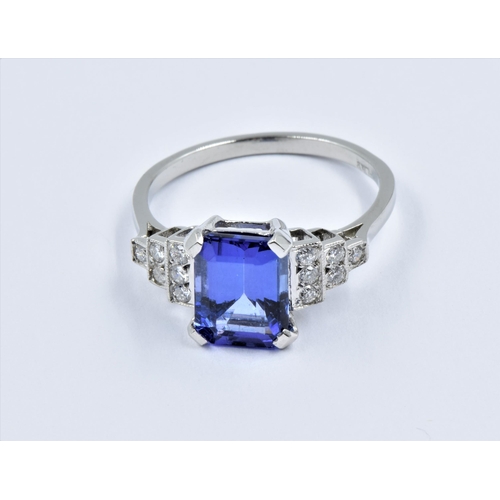 901 - Platinum Art Deco style ring set central tanzanite flanked by diamonds, size N