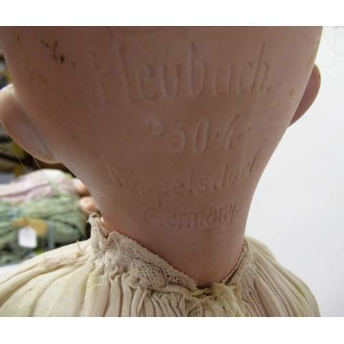 92 - Heubach 2504 bisque headed doll with sleeping eyes and open mouth on a jointed composition body, 22i... 