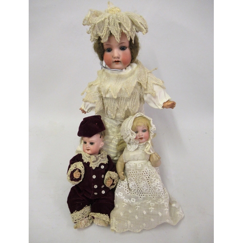 94 - Small Armand Marseille 390 bisque headed doll with jointed composition body, together with two other... 
