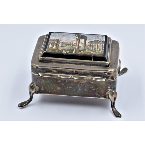 964 - Early 20th Century miniature silver trinket box, the hinged cover inset with a pietra dura panel dep... 