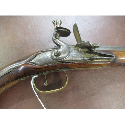 106 - 18th Century Continental flintlock pistol with a tapering steel barrel, engraved steel lock plate, b... 