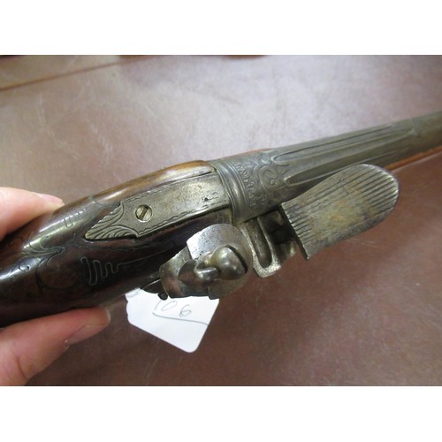 106 - 18th Century Continental flintlock pistol with a tapering steel barrel, engraved steel lock plate, b... 