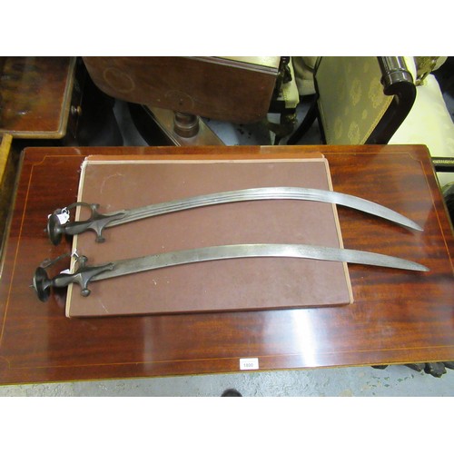 227 - Two 19th Century Indian tulwar swords, together with a replica sword and a fencing foil