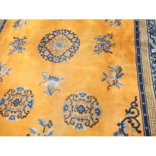 10 - Chinese woollen carpet of Art Deco design on yellow ground, 12ft x 9ft approximately