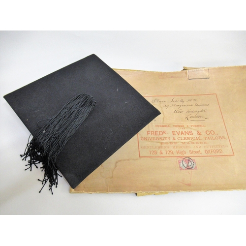 105 - Black graduation gown with mortar board, together with a white fur lined graduation hood