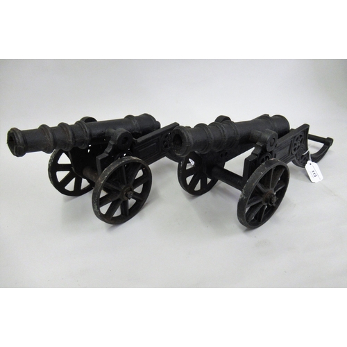 113 - Pair of black painted cast metal signal type cannon