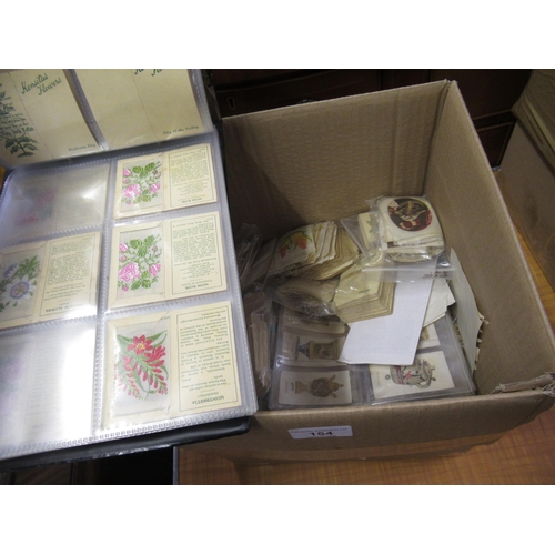 154 - Green album containing a quantity of sets of Kensita's silk flowers and a box containing a large qua... 