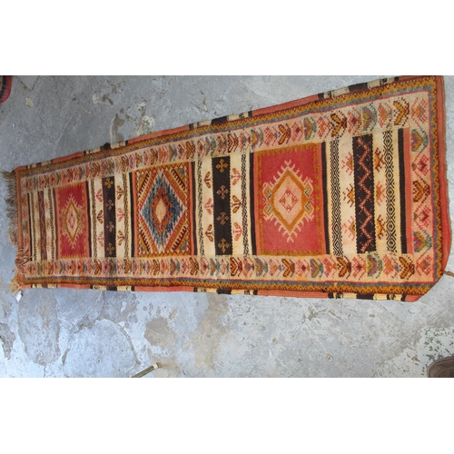 17 - Small runner with a Kelim and part piled triple medallion design, 7ft x 2ft 2ins approximately