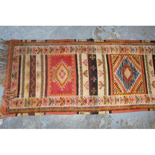 17 - Small runner with a Kelim and part piled triple medallion design, 7ft x 2ft 2ins approximately