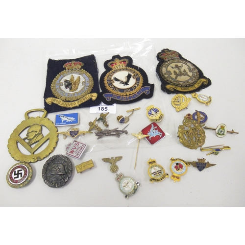 185 - Bag containing a quantity of assorted military cap badges, including some Third Reich items and an o... 