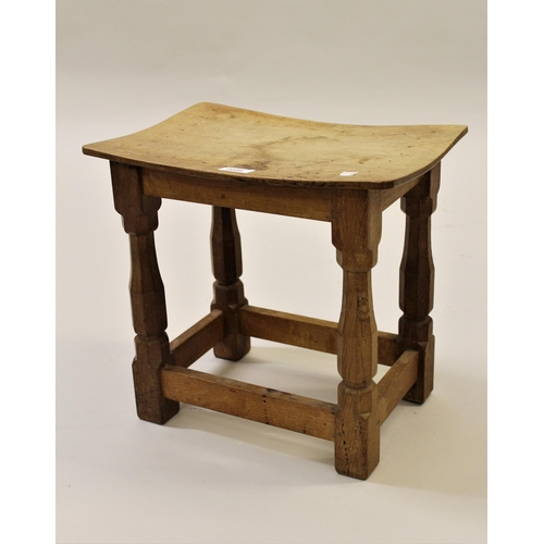 2009 - Robert Mouseman Thompson, small oak stool with a curved seat, raised on octagonal tapering supports ... 