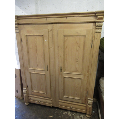 2013 - Large 19th Century Continental stripped pine wardrobe, the moulded cornice above a pair of panel doo... 