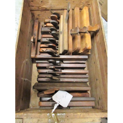 224 - Wooden box containing a collection of various antique moulding planes