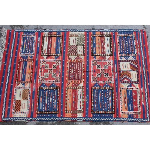 23 - Kelim rug with part piled fifteen panel design in shades of red, blue, terracotta and cream, 8ft 4in... 