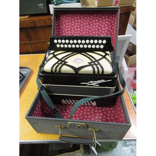 231 - Russian black lacquered accordion in original carry case