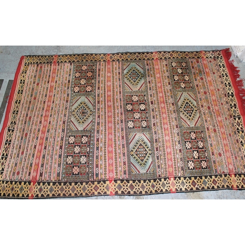 24 - Soumak rug of polychrome panel and banded design in shades of red, pale blue, cream and yellow, 7ft ... 