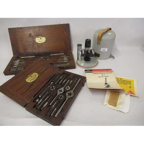 252 - Czechoslovakian Meopta demonstration microscope, together with two cased tap and die sets