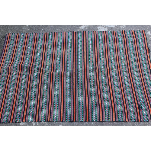 26 - Flatweave rug of polychrome striped design in shades of red, black, green, blue and cream, 7ft x 4ft... 