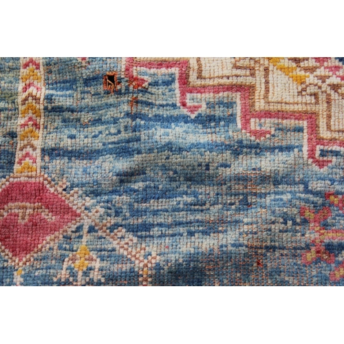 3 - Turkish rug with central medallion in shades of red, blue and orange with a multiple border, 8ft x 5... 