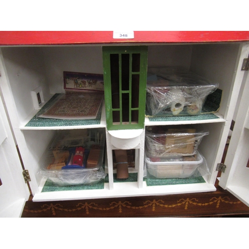 348 - Early 1950's red and white painted doll's house, together with a quantity of furniture