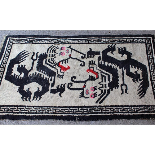 37 - Small Belouch rug, 4ft 3ins x 2ft 10ins approximately, together with a small Chinese black and white... 