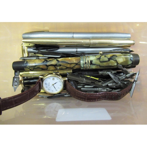 381 - Quantity of various pens and spare nibs and a ladies wristwatch