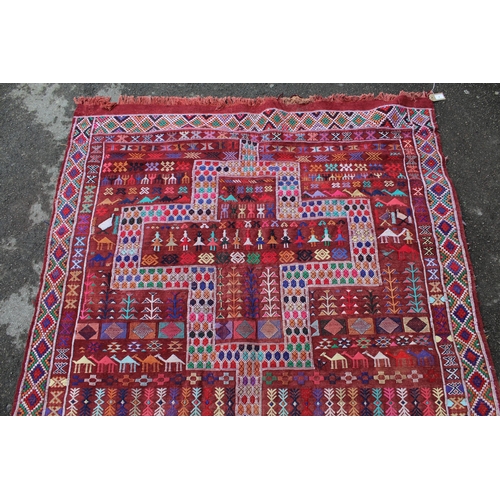 4 - Soumak rug with a twin medallion and all-over polychrome design on a wine ground with borders, 7ft 6... 