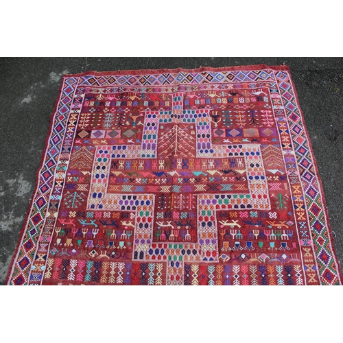 4 - Soumak rug with a twin medallion and all-over polychrome design on a wine ground with borders, 7ft 6... 