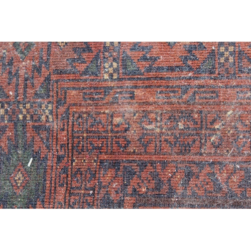 40 - Afghan rug with two rows of five gols on a rust ground with multiple border, 6ft 2ins x 5ft approxim... 