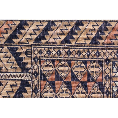 42 - Afghan rug with a twin panel design and multiple borders on a pale terracotta ground, 5ft 8ins x 4ft... 