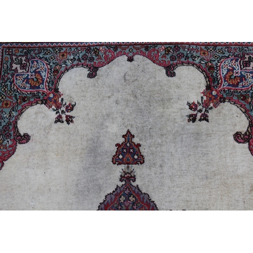 44 - Tabriz rug with a medallion and plain design within a rosette border, 6ft x 4ft approximately (vario... 