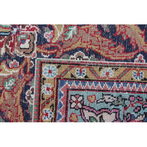 44 - Tabriz rug with a medallion and plain design within a rosette border, 6ft x 4ft approximately (vario... 