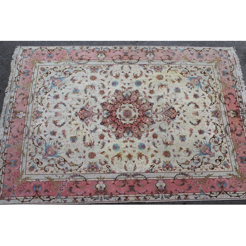 46 - Modern Tabriz part silk carpet with a medallion and all-over floral design on an ivory ground with b... 