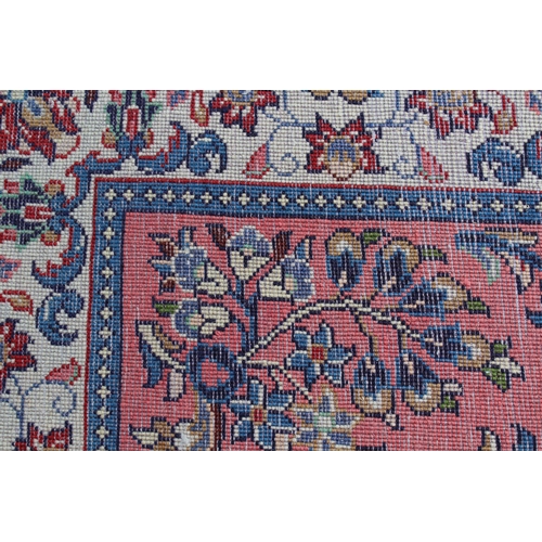 47 - Sarouk runner with a medallion and all-over floral design on a rose ground with borders, 10ft x 2ft ... 