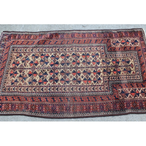 49 - Belouch prayer rug with a Mihrab design in shades of iron red, dark blue and beige, 5ft 2ins x 2ft 1... 