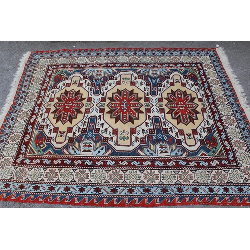 50 - Caucasian flatweave rug of Soumak type, with a triple medallion design in shades of red, yellow ochr... 