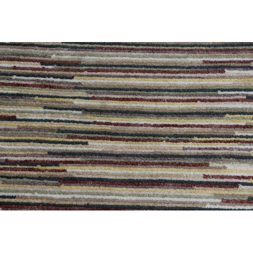 51 - Modern Tibetan rug with a striped design in shades of ivory, beige, green, red and yellow, 7ft 8ins ... 