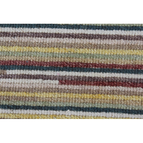 51 - Modern Tibetan rug with a striped design in shades of ivory, beige, green, red and yellow, 7ft 8ins ... 