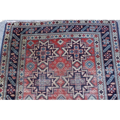 53 - Shirvan rug with eight medallion design on a brick red field with borders, 4ft 10ins x 3ft 8ins appr... 