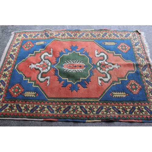 57 - Turkish Persian pattern rug on red ground with multiple borders, 4ft x 6ft