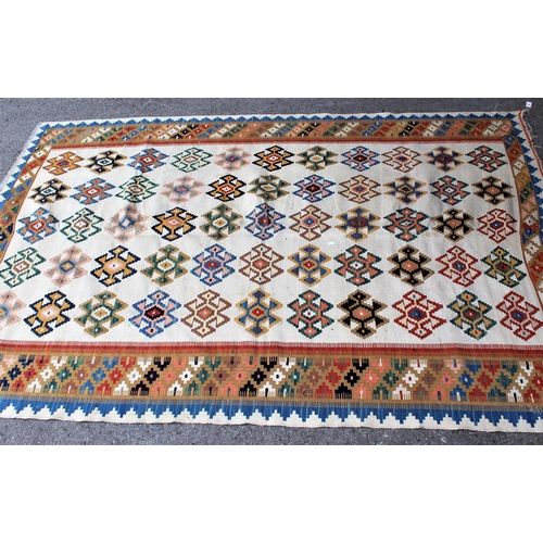 58 - Kelim rug of geometric floral design on beige ground, 7ft x 4ft