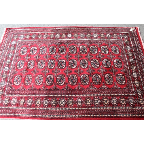 60 - Pakistan rug of Turkoman design with three rows of ten gols on a red ground, 6ft x 4ft 2ins approxim... 